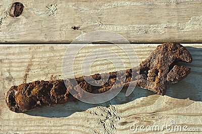 Rusty wrench on wood Stock Photo