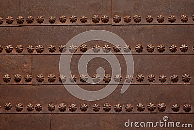 Rustye metal door decorated with abstract flowers Stock Photo