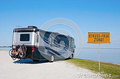 RV at beautiful beach with STRESS FREE ZONE! sign Stock Photo