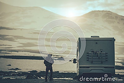 RV Camper Van Travel to Cold and Snowy Mountains During Early Winter Stock Photo