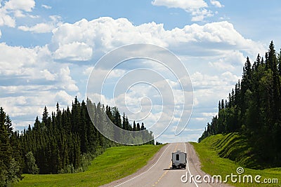 RV drives Alcan south Fort Nelson BC Canada Stock Photo