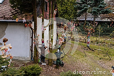 Rvacov near Hlinsko, Czech Republic, 15 April 2022: House of Hanging Dolls, terrible dirty bad plastic dolls hang on trees and on Editorial Stock Photo