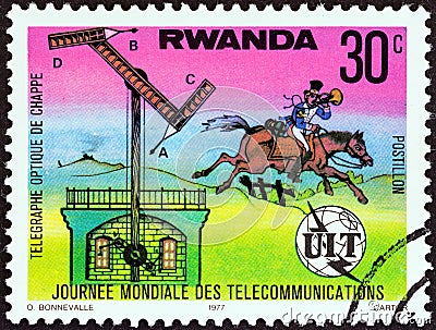 RWANDA - CIRCA 1977: A stamp printed in Rwanda shows Chappe`s semaphore and post rider, circa 1977. Editorial Stock Photo