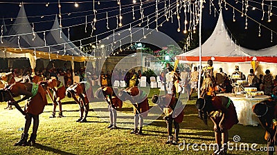 Rwandan and Ugandan dancers performing traditional African dances at the wedding in the evening Editorial Stock Photo