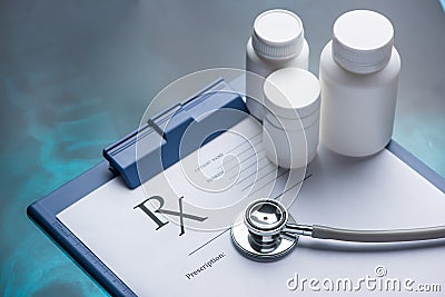 Rx prescription on clipboard with stethoscope Stock Photo