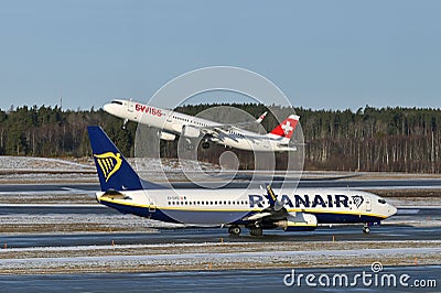 Ryanair Airlines and Swiss Airlines airplanes Editorial Stock Photo