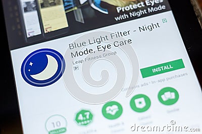 Ryazan, Russia - July 03, 2018: Blue Light Filter - Night Mode, Eye Care mobile app on the display of tablet PC. Editorial Stock Photo