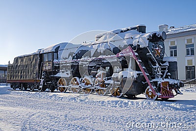 Old Soviet steam locomotive monument (L-5270, Lebedyanka), Rybinsk. Russia Editorial Stock Photo