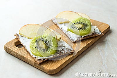 Rye Cripsbread with Cream Cheese, Apple Slices and Kiwi Fruit / Healthy Snacks Recipe Stock Photo