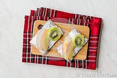 Rye Cripsbread with Cream Cheese, Apple Slices and Kiwi Fruit / Healthy Snacks Recipe Stock Photo