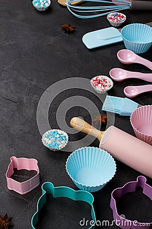 It`s cooking time. Baking tools on dark table. Recipe book background concept. Stock Photo