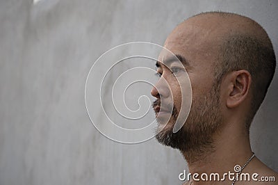 40s cool bald beard man profile portrait background Stock Photo