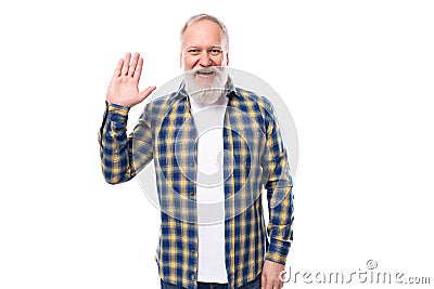 50s elderly gray-haired man with beard greets showing palm on white background Stock Photo