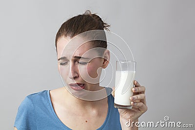 20s girl feeling sick at having to drink milk or soya milk Stock Photo