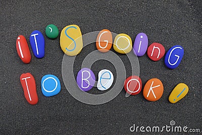 It`s going to be ok, motivational message with colored stones over black volcanic sand Stock Photo