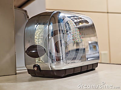 1950`s kitchen reflected in a toaster Stock Photo