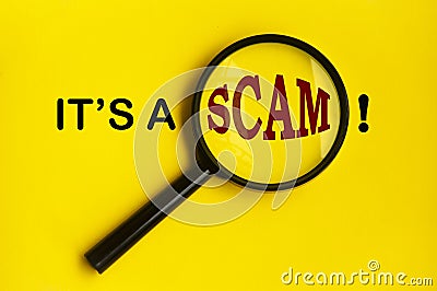 It's a scam text on yellow cover with magnifying glass. Scamming concept Stock Photo