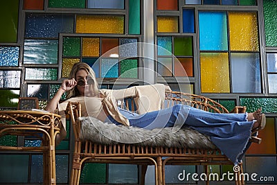 1960`s Sixties inspired shoot - woman in bell-bottom jeans Stock Photo