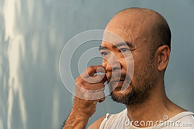 40s tried confusing serious adult portrait of Japanese man Stock Photo