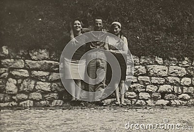 1950s Trio: Young Man with Two Embracing Girls Editorial Stock Photo