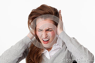 20s woman getting mad at tinnitus issue or loud music Stock Photo