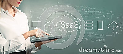 SaaS - software as a service concept with business woman using a tablet Stock Photo