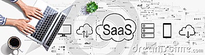 SaaS - software as a service concept with person using a laptop Editorial Stock Photo