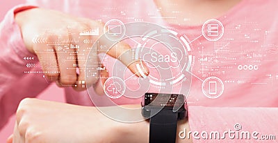 SaaS - software as a service concept with woman pressing smart watch Stock Photo