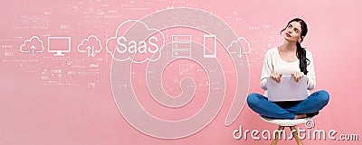 SaaS - software as a service concept with woman using a laptop Stock Photo