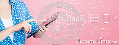 SaaS - software as a service concept with woman using a tablet Stock Photo