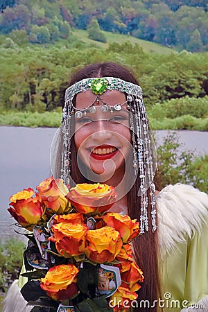 Sabantui celebration in Moscow. Woman in traditional clothes greets visitors. Editorial Stock Photo