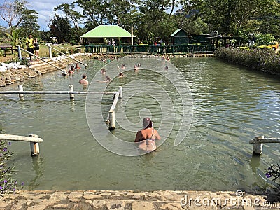 Sabeto Mud Pool hot spring with visitor crowd nearby Nadi, Fiji Editorial Stock Photo