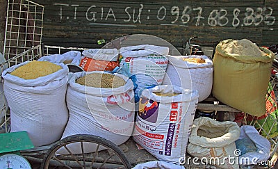 Sacks with flour and grains on street market in Vinh, Vietnam Editorial Stock Photo