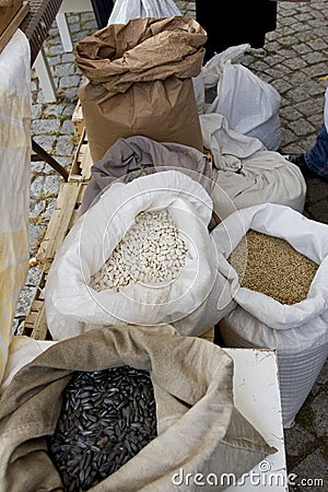 Sacks full with chickpeas, beans, buckwheat, millet, wheat, spelled, lentils, Einkorn wheat grains. Variety of beans, grains and s Stock Photo