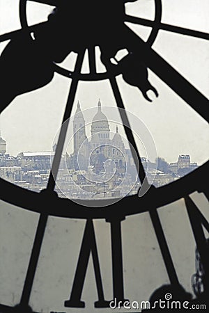 Sacre-Coeur viewed through clock tower in Museum Orsay in Paris Editorial Stock Photo