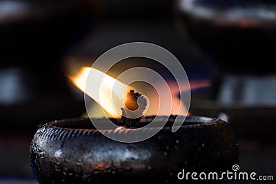 Sacred fire, coconut oil lamps in a buddhist temple Stock Photo