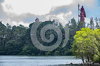 Sacred lake of ganga Talao with statue of lord Shiva in the background. Stock Photo