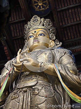 Gold Buddha statue at Gandantegchinlen Monastery in Ulaanbaatar Mongolia Stock Photo