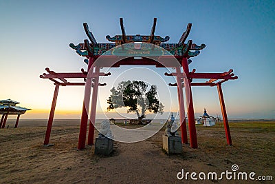 The sacred tree in Kalmykia. Silhouette of a gate or arch at the entrance to the cult object Stock Photo