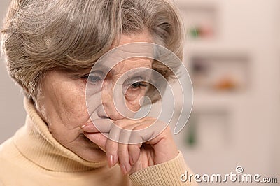 Sad aged woman Stock Photo