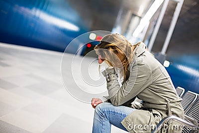 Sad and alone in a big city - Depressed young woman Stock Photo