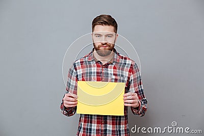 Sad angry bearded man holding copyspace blank Stock Photo