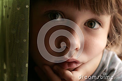 Sad, bored, daydreaming child Stock Photo