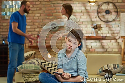 Sad boy arguing parents Stock Photo