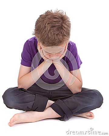 Sad boy with drooping head Stock Photo