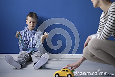 Sad boy on the floor Stock Photo