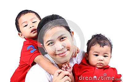 A sad boy, smiling mother, cool infant. Stock Photo