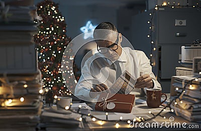 Businessman receiving a boring Christmas gift Stock Photo