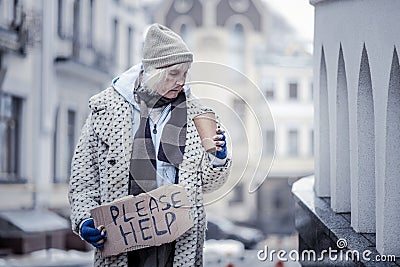 Sad cheerless woman looking into the cup Stock Photo