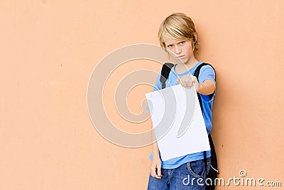 Sad child showing bad exam results Stock Photo